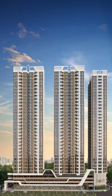 The image showcases a towering residential complex at Dosti West County, with three high-rise buildings set against a clear sky. The elegant modern design features sleek balconies and large windows, highlighting the architectural beauty and urban setting of Thane's Dosti Balkum area.